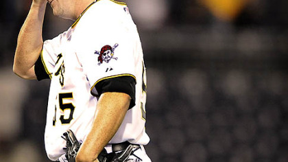 Pirates reliever Matt Capps wipes his forehead after serving up a three run homer to the Brewers Rickie Weeks in the ninth inning tonight at PNC Park.