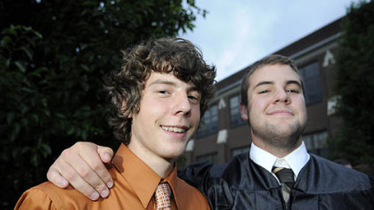 Alex with Tom Skemp, his friend since kindergarten, following graduation.