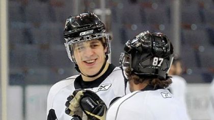 Evgeni Malkin and Sidney Crosby appear carefree at practice yesterday, but both will have to be at the top of their games tonight in order to extend the Penguins' season to Friday.