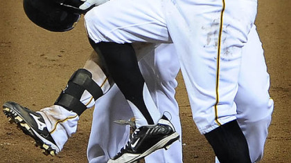 Andrew McCutchen celebrates with Nyger Morgan and Eric Hinske (rear) after knocking in the winning run in the ninth inning against the Indians during their game at PNC Park, June 25, 2009.
