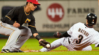 Pirates shortstop Ronny Cedeno tries to tag Houston Astros second baseman Kazuo Matsui on a steal during the third inning. Matsui later scored on a double by first baseman Lance Berkman.