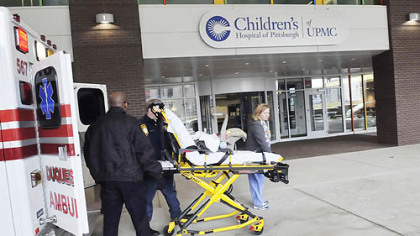 Children's Hospital carries out a mock move into its new quarters in Lawrenceville yesterday. Ambulance teams brought in mannequins on gurneys. The drill was in preparation for the actual move, which will take place May 2.