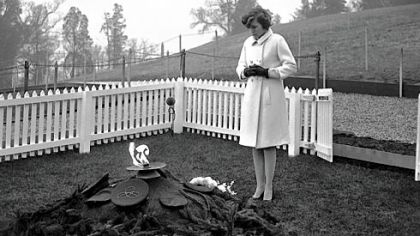 Eunice Kennedy Shriver, sister of slain President John F. Kennedy, stands at his grave site at Arlington National Cemetery on Nov. 22, 1965.
