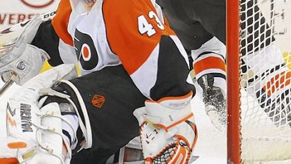Flyers goalie Martin Biron makes a save against Jordan Staal in the third period.