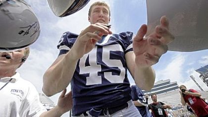Penn State linebacker Sean Lee, coming back after missing 2008 because of knee surgery, signs autographs before the Blue-White game yesterday.