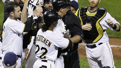 Pirates pitcher Jeff Karstens, middle center facing right, is helped out of an altercation with Brewers catcher Jason Kendall, left center facing camera, by teammate Andre McCutchen during the eighth inning.  At far left is Pirates infielder Ramon Vazquez and at far right is Pirates catcher Ryan Doumit.