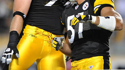 Steelers James Farrior celebrates with Brett Keisel after scoring in the first half against the Buffalo Bills Thursday.