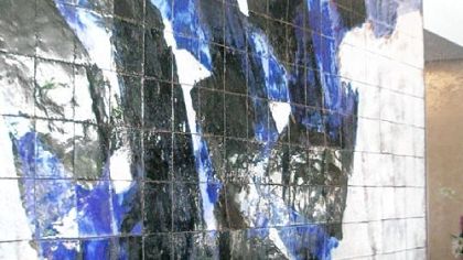 Pierre Soulages' untitled terra cotta tile mural is in the lobby of One Oliver Plaza -- for now.