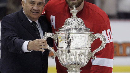 National Hockey League senior vice president of hockey operations Jim Gregory, left, and Detroit Red Wings center Henrik Zetterberg (40) stand with the Clarence S. Campbell Bowl after the Red Wings defeated the Chicago Blackhawks in Game 5 of the Western Conference hockey finals in Detroit tonight. (AP Photo/Carlos Osorio)