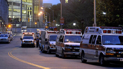 Ambulances line up outside the entrance of the old Children's Hospital on DeSoto Street in Oakland around 6 a.m. today to transport patients to the hospital's  new Lawrenceville home.