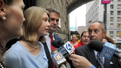 Sarah DeIuliis answers reporters' questions yesterday.