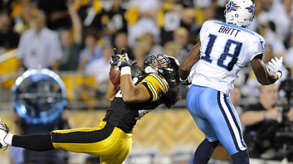 Steelers saftey Troy Polamalu intercepts a pass intended for Titans wide receiver Kenny Britt in the first quarter Thursday at Heinz Field. Polamalu left the game in the second quarter due to a knee injury and did not return.