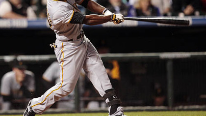 Andrew McCutchen follows through with his swing after connecting for a triple to drive in three runs against the Colorado Rockies in the seventh inning of last night's  baseball game in Denver.