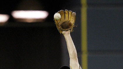 Pirates shortstop Jack Wilson leaps to catch a ball hit by Houston Astros third baseman Geoff Blum during the fifth inning of last night's game.