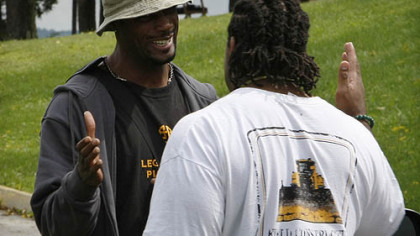 Steelers wide receiver Limas Sweed, left, greets offensive lineman Willie Colon as they arrive at training camp.