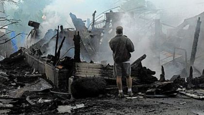 The burned out remains of a barn, used as a locker room for the pool at Montour Heights Country Club in Moon, was destroyed by flames that broke out arond 4:30 a.m. Investigators are trying to determine the cause of blaze.