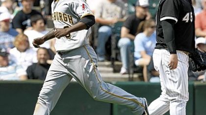 White Sox closer Bobby Jenks looks away as Nyjer Morgan scores the winning run in the ninth inning yesterday in Chicago.