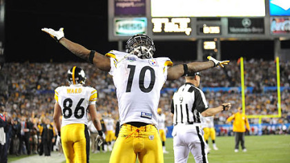 Receiver Santonio Holmes throws his arms wide in joy after an acrobatic catch that gave the Steelers the lead and the win over the Cardinals in Super Bowl XLIII.