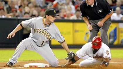 Diamondbacks outfielder Justin Upton is caught stealing third base on a tag by Pirates third baseman Andy LaRoche in the first inning.