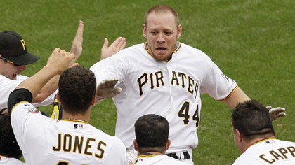 Pirates outfielder Brandon Moss (44) is greeted by teammates as he arrives home after hitting a game-winning walk-off solo-home run off Brewers pitcher Mitch Stetter in the ninth inning.