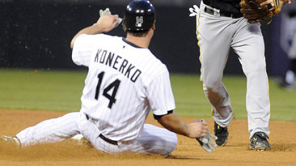 The Chicago White Sox's Paul Konerko, left, is forced out at second by Pirates shortstop Jack Wilson, right, during the fourth inning of last night's baseball game in Chicago.