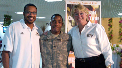 Pitt Coach Agnus Berenato  and some of the soldiers she and the coaches group are visitng.
