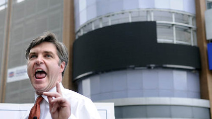 Pittsburgh Councilman Patrick Dowd, standing in front of the billboard at 11th Street and Liberty Avenue, speaks out against the "culture of deception and corruption" in the Ravenstahl administration.