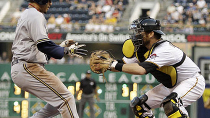 Pirates catcher Ryan Doumit waits to put the tag on  Brewers second baseman Felipe Lopez who was going on contact on a ground ball by Brewers outfielder Ryan Braun in the fifth inning.