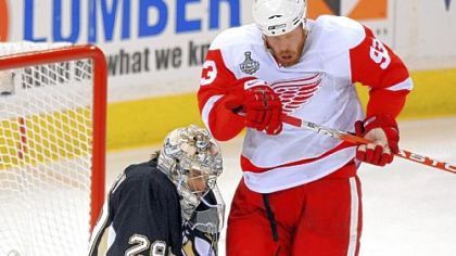 Marc-Andre Fleury stops a shot and Detroit's Johan Franzen in the second period of Game 3 last night at Mellon Arena. Fleury stopped 27 shots in the game.
