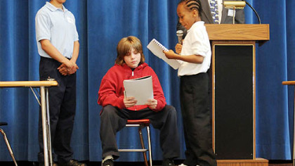 Fifth-grade students at Pittsburgh Allegheny K-5 on the North Side participate in a mock trial.  From left are the bailiff, Hugo Garcia; defendant "Jackie Bean," played by Isaiah Trembulak; prosecutor, Jaquan Peter, and the judge, John M. McIntyre of Reed Smith.