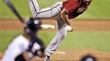 Diamondbacks pitcher Yusmeiro Petit delivers to  Pirates shortstop Ronny Cedeno in the eighth inning. Cedeno singled on the pitch and ended a bid for a no-hitter by Petit.