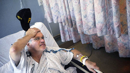 Charles Trimble of Corry, Erie County, talks from his bed at Allegheny General Hospital yesterday.