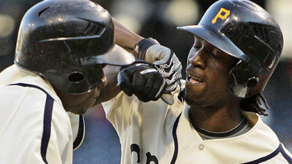 Pirates outfielder Andrew McCutchen, right, celebrates with teammate Nyjer Morgan after Morgan's home run.