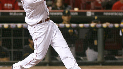 Reds second baseman Brandon Phillips hits a single off Pirates pitcher Paul Maholm in the fifth inning during the second game.