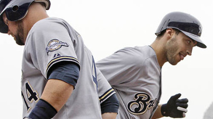 Brewers outfielder Ryan Braun, right, is greeted by teammate Casey McGehee (14) after hitting a first-inning solo home run off Pirates pitcher Paul Maholm.