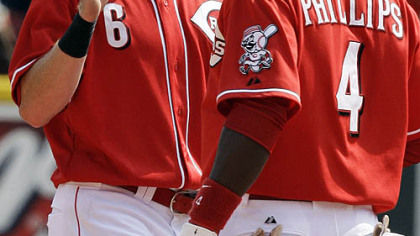 Reds outfielder Drew Stubbs and second baseman Brandon Phillips congratulate each other after yesterday's win. Stubbs and Phillips both hit home runs in the game.