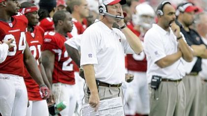 Cardinals coach Ken Whisenhunt wipes his face in the closing moments of a preseason loss to the Texans in August 2007.