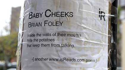 Brian Foley's poem "Baby Cheeks" is taped to a pole in the Strip District on Penn Avenue near 28th Street, part of the www.isReads.com project.