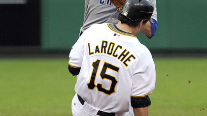 Cubs infielder Mike Fontenot gets Pirates third baseman Andy LaRoche out at second base in the second inning last night.