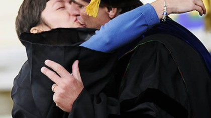 Randy Pausch kisses his wife, Jai, after giving the charge to graduates at Carnegie Mellon University's 111th commencement ceremony on May 18, 2008. He died of pancreatic cancer one year ago yesterday.