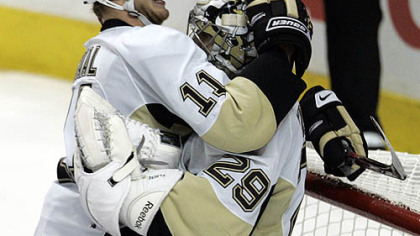 Jordan Staal bear hugs Marc-Andre Fleury in the moments after the Penguins completed their remarkable comeback to beat the Flyers yesterday at Wachovia Center in Philadelphia and advance to the second round of the NHL playoffs.