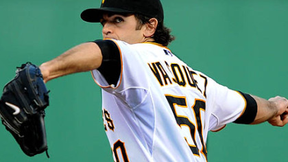 Pirates Virgil Vasquez delivers at pitch against the Brewers.
