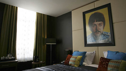 A portrait of Paul McCartney hangs on the wall of a suite at the newly opened Hard Days Night Hotel, Friday, Feb. 1, 2008, in Liverpool, England. Visitors to Liverpool, birthplace of the Beatles, can rest their heads in the Lennon or McCartney suites at the Hard Days Night Hotel, a Fab Four-themed hostelry that opened Friday. More than 45 years after John, Paul, George and Ringo emerged from Liverpool's tiny, sweaty clubs to conquer the world, the Beatles industry is key to this battered-but-proud city''s attempt to transform itself from fading commercial hub to thriving cultural hotbed. The 110-room Hard Days Night Hotel hopes to be its newest attraction.