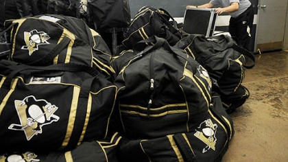 Mellon Arena
Equipment manager Dana Heinze gets the Penguins' gear ready outside of the locker room yesterday for the trip to Detroit for tonight's Game 5 in a Stanley Cup final tied at 2-2.