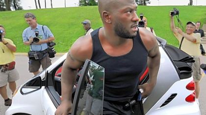 Pittsburgh Steelers James Harrison manages to get out of his Smart car stopping in front of Rooney Hall at St. Vincent College Latrobe on the first day of training camp.