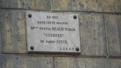 This plaque on a building at 12 rue de L'Odeon, Paris, acknowledges the initial publication of James Joyce's "Ulysses" by the Shakespeare and Company Bookstore owned by American Sylvia Beach. The publisher was Harriet Shaw Weaver.