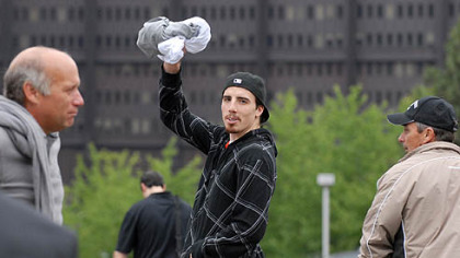 Penguin goalie Marc-Andre Fleury waves to fans outside of Mellon Arena as he leaves after practice yesterday.