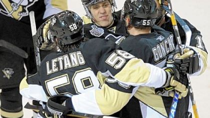 Sergei Gonchar, center, is mobbed after scoring the winning goal in the third period.