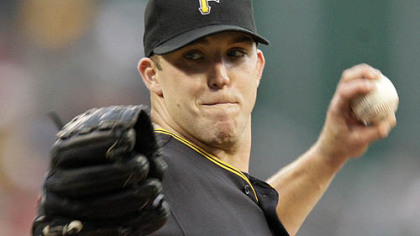 Pirates pitcher Paul Maholm throws in the first inning.