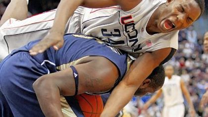 Pitt's DeJuan Blair tosses Connecticut's Hasheem Thabeet over his back as they fight for a rebound in the first half last night in Hartford, Conn. Thabeet was called for a foul on the play.